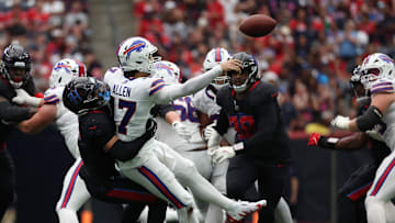 Oct 6, 2024; Houston, Texas, USA;  Buffalo Bills quarterback Josh Allen (17) gets hit by Houston Texans safety Jalen Pitre (5) in the second half at NRG Stadium. Mandatory Credit: Thomas Shea-Imagn Images