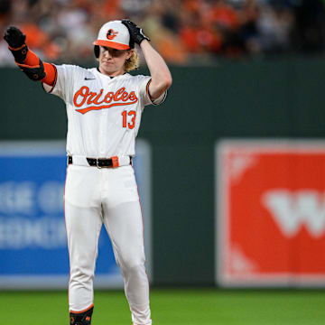 Jun 30, 2024; Baltimore, Maryland, USA; Baltimore Orioles outfielder Heston Kjerstad (13) reacts after hitting a double during the fourth inning against the Texas Rangers at Oriole Park at Camden Yards. 