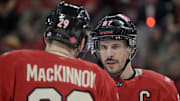 Feb 15, 2025; Montreal, Quebec, CAN; [Imagn Images direct customers only] Team Canada forward Nathan MacKinnon (29) and teammate forward Sidney Crosby (87) prepare for a face-off against Team United States in the second period during a 4 Nations Face-Off ice hockey game at the Bell Centre. Mandatory Credit: Eric Bolte-Imagn Images