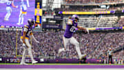 Dec 7, 2025; Minneapolis, Minnesota, USA; Minnesota Vikings tight end T.J. Hockenson (87) reacts after scoring a touchdown against the Washington Commanders during the second half at U.S. Bank Stadium. Mandatory Credit: Brad Rempel-Imagn Images