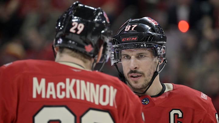 Feb 15, 2025; Montreal, Quebec, CAN; [Imagn Images direct customers only] Team Canada forward Nathan MacKinnon (29) and teammate forward Sidney Crosby (87) prepare for a face-off against Team United States in the second period during a 4 Nations Face-Off ice hockey game at the Bell Centre. Mandatory Credit: Eric Bolte-Imagn Images