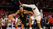 Minnesota forward Dawson Garcia drives to the basket as Maryland center Derik Queen defends during the first half at Xfinity Center in College Park, Md., on Jan. 13, 2025.