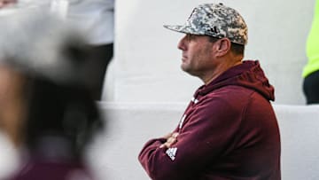 Mississippi State head coach Chris Lemonis watches from the dugout against Ole Miss at Swayze Field in Oxford, Miss., on Friday, Apr. 12, 2024.