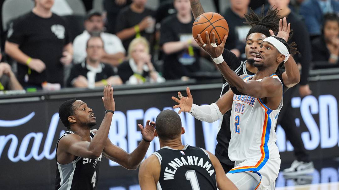 Shai Gilgeous-Alexander surrounded by defenders in the Western Conference finals.