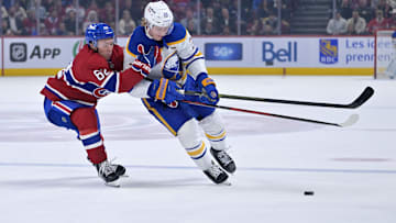 Oct 20, 2025; Montreal, Quebec, CAN; Montreal Canadiens forward Owen Beck (62) and Buffalo Sabres defenseman Rasmus Dahlin (26) battle for the puck during the second period at the Bell Centre. Mandatory Credit: Eric Bolte-Imagn Images