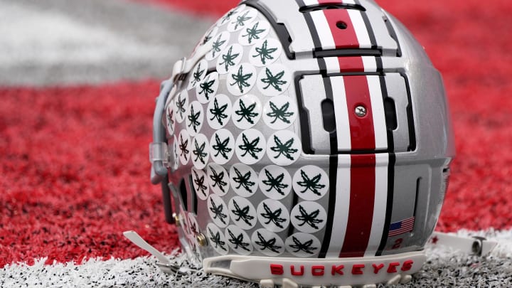 Oct. 1, 2022; Columbus, Ohio, USA; A stick-ladden Ohio State Buckeyes helmet sits on the turf during warmups before Saturday's game against the Rutgers Scarlet Knights in Columbus. Mandatory Credit: Barbara Perenic/Columbus Dispatch

Sports Ohio State Rutgers Ncaa Football