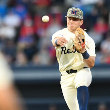 Ole Miss infielder Luke Hill (7) fields, steps on second for an out, and throws to first for a double play in the 2nd inning at Swayze Field in Oxford, Miss., on Friday, Apr. 12, 2024.