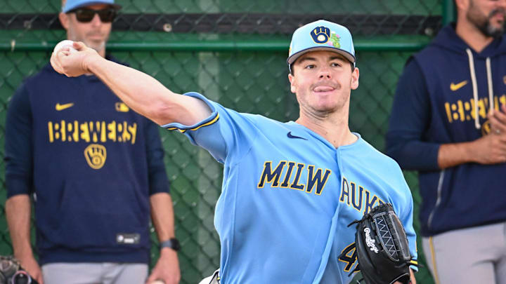 Milwaukee Brewers pitcher Logan Henderson (43) throws in the bullpen during spring training workouts.
