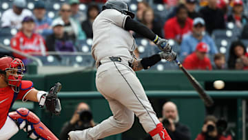 Apr 6, 2025; Washington, District of Columbia, USA; Arizona Diamondbacks catcher Jose Herrera (11) hits a home run during the second inning against the Washington Nationals at Nationals Park. Mandatory Credit: Daniel Kucin Jr.-Imagn Images