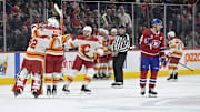 Nov 5, 2024; Montreal, Quebec, CAN; The Calagary Flames celebrate the win against the Montreal Canadiens during the overtime period at the Bell Centre. Mandatory Credit: Eric Bolte-Imagn Images