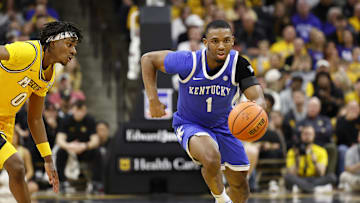 Mar 8, 2025; Columbia, Missouri, USA; Kentucky Wildcats guard Lamont Butler (1) dribbles past Missouri Tigers guard Anthony Robinson II (0) in the second half at Mizzou Arena. Mandatory Credit: Gary Rohman-Imagn Images