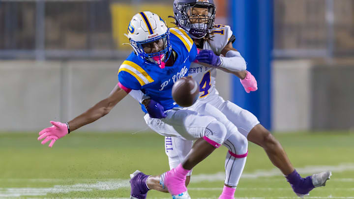 Pflugerville Panthers wide receiver Kyran McFrazier tries to reach for a pass as defensive back Liberty Hill Panthers Eyan Jones defends.