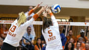 Texas Longhorns middle blocker Ayden Ames (5) and outside hitter Jenna Wenaas (13) block a spike during the scrimmage volleyball match against UTSA at Gregory Gym on Saturday, Aug. 17, 2024 in Austin.