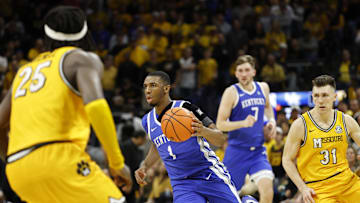 Mar 8, 2025; Columbia, Missouri, USA; Kentucky Wildcats guard Lamont Butler (1) with the ball down the court between Missouri Tigers guard Mark Mitchell (25) and Missouri Tigers guard Caleb Grill (31) in the second half at Mizzou Arena. Mandatory Credit: Gary Rohman-Imagn Images
