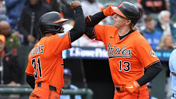 Apr 12, 2025; Baltimore, Maryland, USA; Baltimore Orioles outfielder Heston Kjerstad (13) celebrates with Baltimore Orioles outfielder Cedric Mullins (31) after hitting a home run during the fifith inning against the Toronto Blue Jays at Oriole Park at Camden Yards. Mandatory Credit: Daniel Kucin Jr.-Imagn Images