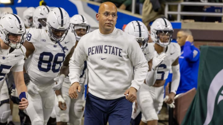 Penn State Nittany Lions head coach James Franklin leads his team to the field against the Michigan State Spartans at Ford Field.