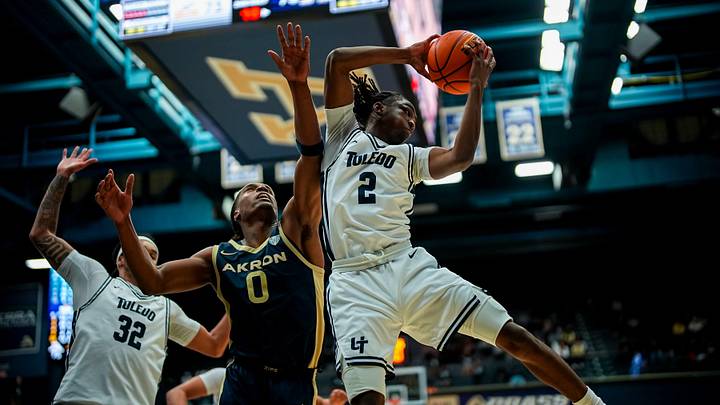 University of Toledo’s Leroy Blyden Jr. (2) grabs a rebound over University of Akron’s Amani Lyles (0), Jan. 27, 2026, at James A Rhodes Arena in Akron, Ohio.