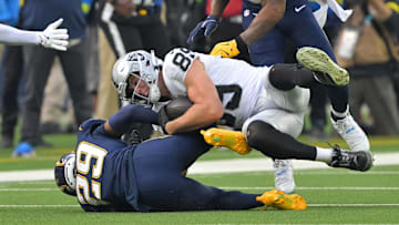 Nov 30, 2025; Inglewood, California, USA; Las Vegas Raiders tight end Brock Bowers (89) makes a catch against Los Angeles Chargers cornerback Tarheeb Still (29) during the first half at SoFi Stadium. Mandatory Credit: Jayne Kamin-Oncea-Imagn Images