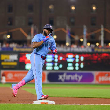 Jul 29, 2024; Baltimore, Maryland, USA; Toronto Blue Jays first baseman Vladimir Guerrero Jr. (27) rounds third base after hitting a home run during the eighth inning against the Baltimore Orioles at Oriole Park at Camden Yards.