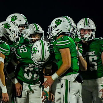 Mogadore’s offensive line huddles in an OHSAA DVII region 25 quarterfinal football game against East Palestine, Nov. 7, 2025, in Mogadore, Ohio.