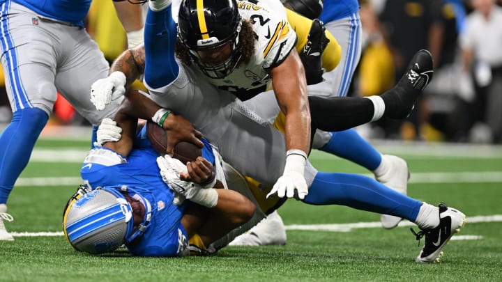 Detroit Lions quarterback Hendon Hooker (2) is sacked.