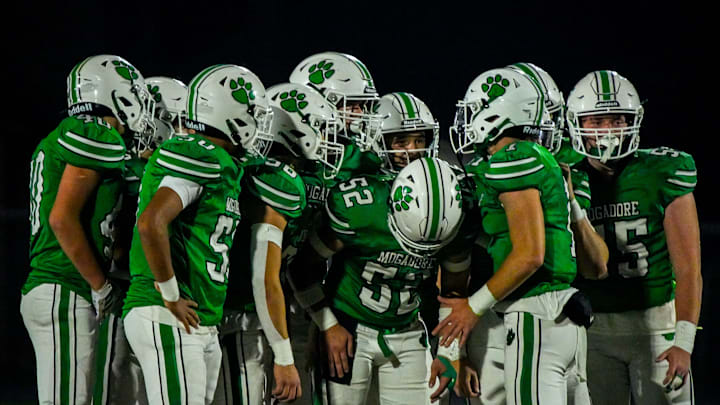 Mogadore’s offensive line huddles in an OHSAA DVII region 25 quarterfinal football game against East Palestine, Nov. 7, 2025, in Mogadore, Ohio.