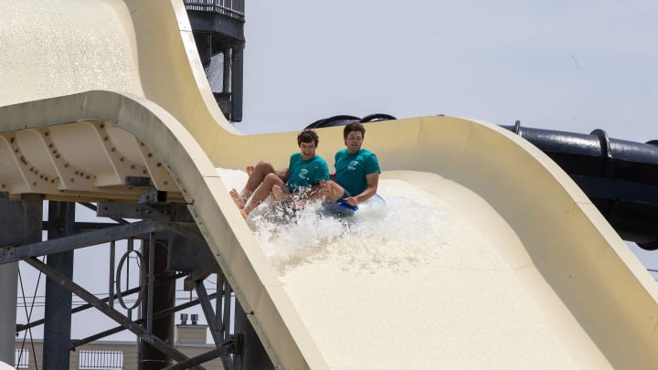 Chris McArthur, 20, of Branchburg and Ethan Patrick, 20, of Branchburg, both camp counselors for Branchburg Recreation Summer Camp, cool off on a waterslide at Runaway Rapids in Keansburg, NJ Tuesday, July 9, 2024.