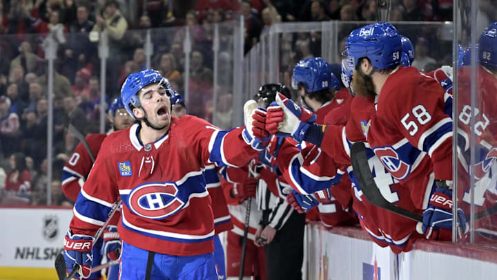 Apr 16, 2024; Montreal, Quebec, CAN; Montreal Canadiens forward Alex Newhook (15) celebrates with teammates after scoring a goal against the Detroit Red Wings during the first period at the Bell Centre. Mandatory Credit: Eric Bolte-Imagn Images