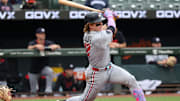 May 14, 2025; Baltimore, Maryland, USA; Minnesota Twins outfielder Harrison Bader (12) hits a double during the sixth inning against the Baltimore Orioles at Oriole Park at Camden Yards.