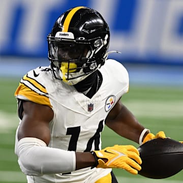 Aug 24, 2024; Detroit, Michigan, USA;  Pittsburgh Steelers wide receiver George Pickens (14) runs upfield after catching a pass against the Detroit Lions in the first quarter at Ford Field. Mandatory Credit: Lon Horwedel-Imagn Images