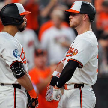 Jun 26, 2024; Baltimore, Maryland, USA; Baltimore Orioles first base Ryan O'Hearn (32) celebrates with outfielder Anthony Santander (25) after a home run during the eighth inning at Oriole Park at Camden Yards.