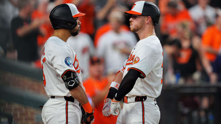 Jun 26, 2024; Baltimore, Maryland, USA; Baltimore Orioles first base Ryan O'Hearn (32) celebrates with outfielder Anthony Santander (25) after a home run during the eighth inning at Oriole Park at Camden Yards.