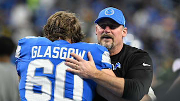 Dec 5, 2024; Detroit, Michigan, USA; Detroit Lions head coach Dan Campbell greets guard Graham Glasgow (60) during pregame warmups before their game against the Green Bay Packers at Ford Field. Mandatory Credit: Lon Horwedel-Imagn Images