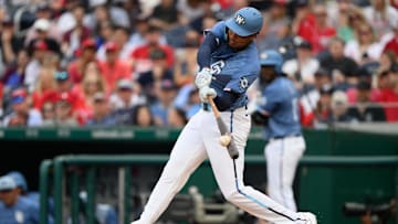 Mar 29, 2025; Washington, District of Columbia, USA; Washington Nationals outfielder James Wood (29) hits a double during the fifth inning against the Philadelphia Phillies at Nationals Park. 