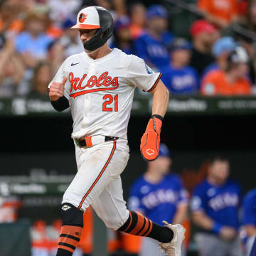 Jun 30, 2024; Baltimore, Maryland, USA; Baltimore Orioles outfielder Austin Hays (21) scores a run during the fourth inning against the Texas Rangers at Oriole Park at Camden Yards. 