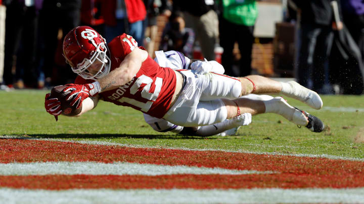 Oklahoma Sooners wide receiver Drake Stoops (12) dives for a touchdown during a college football game between the University of Oklahoma Sooners (OU) and the TCU Horned Frogs at Gaylord Family-Oklahoma Memorial Stadium on Friday, Nov. 24, 2023. Oklahoma won 69-45.