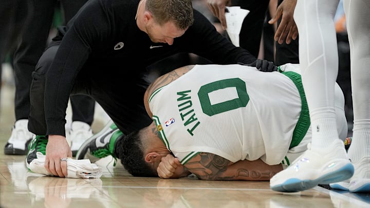 Jayson Tatum #0 of the Boston Celtics reacts after injury against the Sacramento Kings.