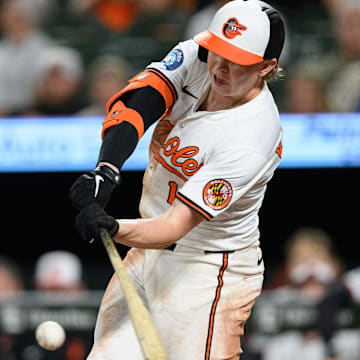 Apr 30, 2025; Baltimore, Maryland, USA; Baltimore Orioles outfielder Heston Kjerstad (13) hits a single during the eighth inning against the New York Yankees at Oriole Park at Camden Yards.
