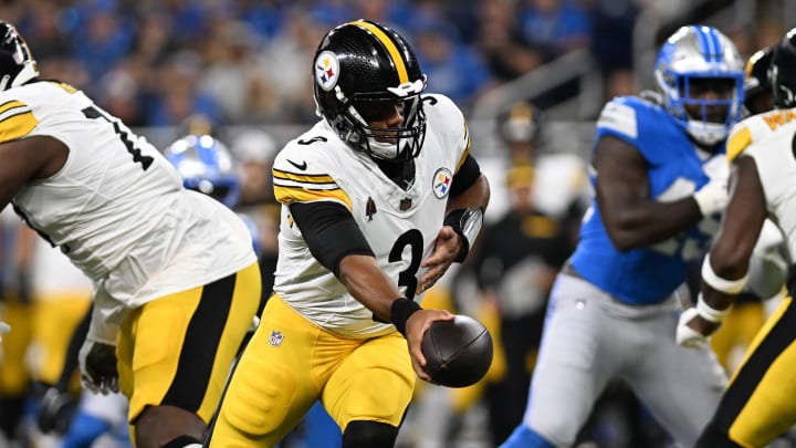 Aug 24, 2024; Detroit, Michigan, USA;  Pittsburgh Steelers quarterback Russell Wilson (3) hands the ball off against the Detroit Lions in the first quarter at Ford Field. Mandatory Credit: Lon Horwedel-USA TODAY Sports