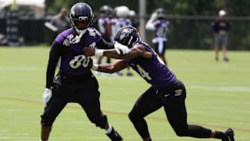 Jun 10, 2025; Baltimore, MD, USA; Baltimore Ravens tight end Isaiah Likely (80) runs past Baltimore Ravens tight end Zaire Mitchell-Paden (84) during an NFL OTA at Under Armour Performance Center. Mandatory Credit: Daniel Kucin Jr.-Imagn Images