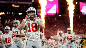 Ohio State Buckeyes quarterback Will Howard (18) take the field for the start of the game against Notre Dame Fighting Irish during the College Football Playoff National Championship at Mercedes-Benz Stadium in Atlanta on January 20, 2025.