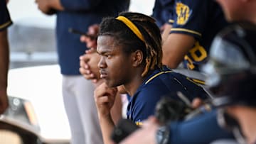 Milwaukee Brewers shortstop prospect Jesus Made sits in the dugout during spring training workouts Monday, February 17, 2025, at American Family Fields of Phoenix in Phoenix, Arizona.