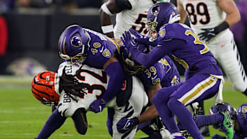 Nov 27, 2025; Baltimore, Maryland, USA; Baltimore Ravens linebacker Teddye Buchanan (40) tackles Cincinnati Bengals running back Gary Brightwell (32) during the first half at M&T Bank Stadium. Mandatory Credit: Mitch Stringer-Imagn Images