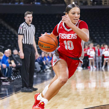 Fishers High School's Riley Schellhammer (10) drives the ball to the baseline during the first half of an IHSAA basketball game against Hamilton Southeastern last December. Schellhammer transferred to Indiana power Lawrence Central after her freshman season but has since left the team.