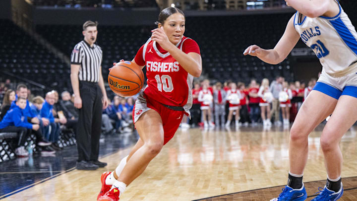 Fishers High School's Riley Schellhammer (10) drives the ball to the baseline during the first half of an IHSAA basketball game against Hamilton Southeastern last December. Schellhammer transferred to Indiana power Lawrence Central after her freshman season but has since left the team.