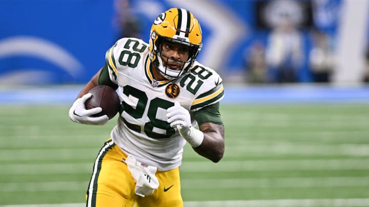 Nov 23, 2023; Detroit, Michigan, USA; Green Bay Packers running back AJ Dillon (28) runs the ball against the Detroit Lions in the first quarter at Ford Field. Mandatory Credit: Lon Horwedel-USA TODAY Sports