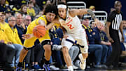 Mar 2, 2025; Ann Arbor, Michigan, USA; Michigan Wolverines guard Tre Donaldson (3) battles Illinois Fighting Illini guard Dra Gibbs-Lawhorn (2) for a loose ball in the first half at Crisler Center. Mandatory Credit: Lon Horwedel-Imagn Images