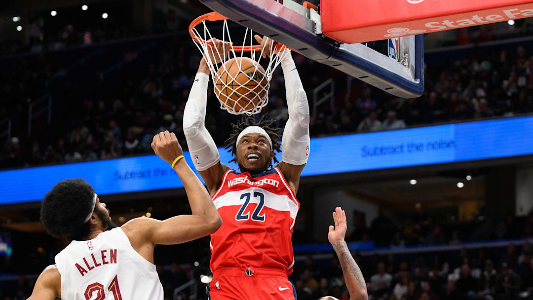 Feb 7, 2025; Washington, District of Columbia, USA; Washington Wizards forward Richaun Holmes (22) dunks the ball over Cleveland Cavaliers center Jarrett Allen (31) during the second quarter at Capital One Arena. Mandatory Credit: Reggie Hildred-Imagn Images