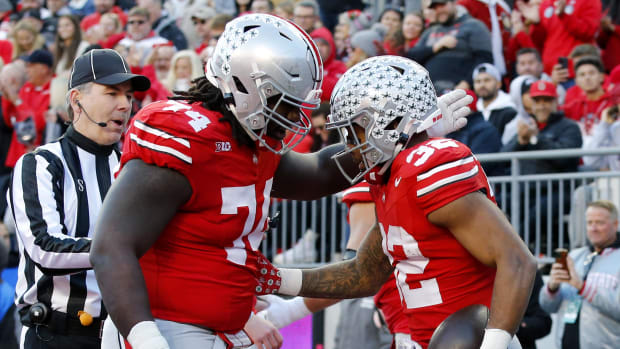 Teammates celebrate after a touchdown.