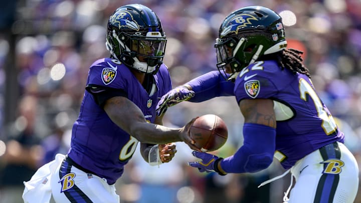 Baltimore Ravens quarterback Lamar Jackson (8) hands off to running back Derrick Henry (22) during the first half against the Las Vegas Raiders at M&T Bank Stadium.